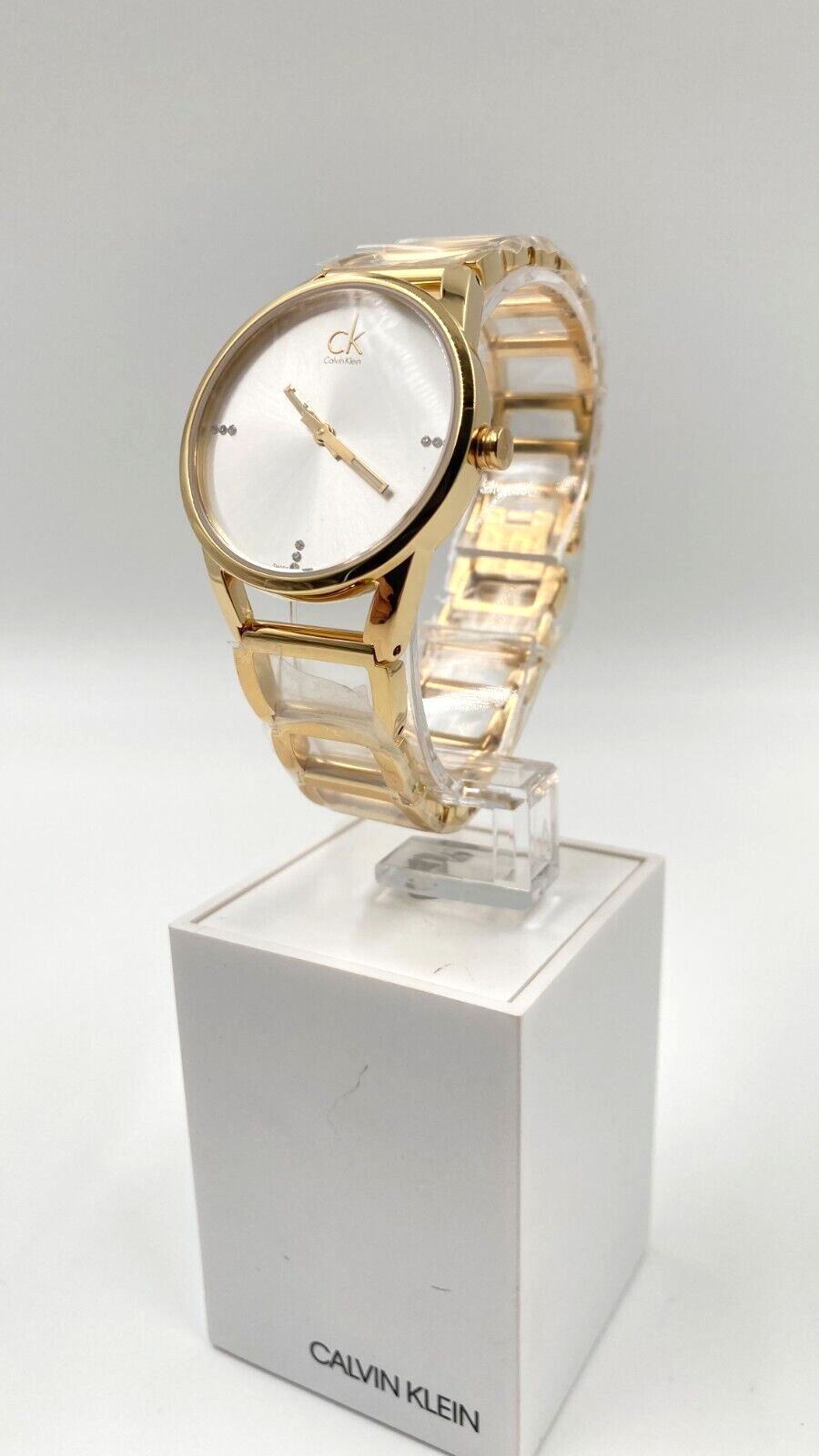 CALVIN KLEIN Quarz Damenarmbanduhr silbernes Zifferblatt gelbgoldene Beschichtung