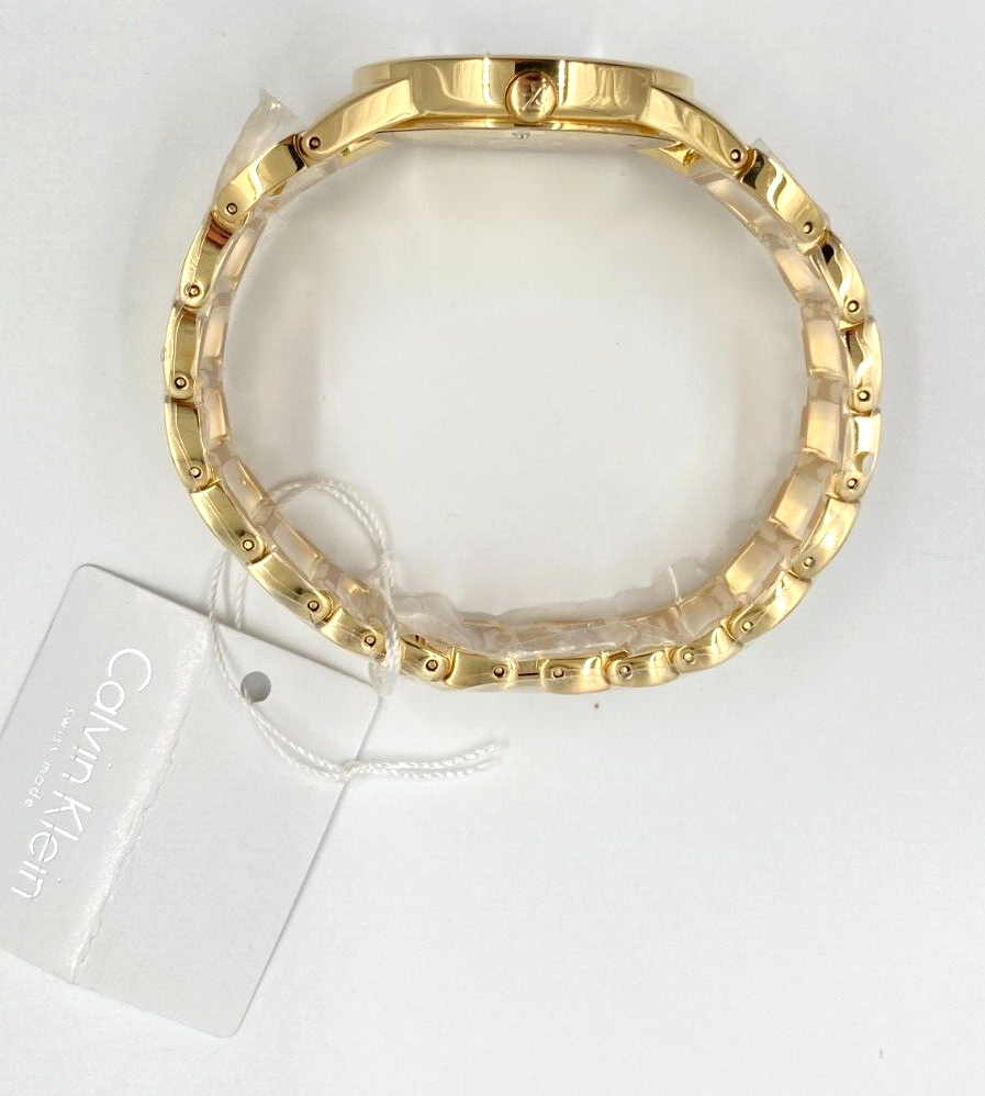 CALVIN KLEIN Quarz Damenarmbanduhr silbernes Zifferblatt gelbgoldene Beschichtung