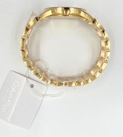 CALVIN KLEIN Quarz Damenarmbanduhr silbernes Zifferblatt gelbgoldene Beschichtung