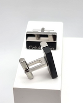 Calvin Klein Boost Manschettenknöpfe für Herren aus Edelstahl in Silber und Schwarz, elegant und modern.