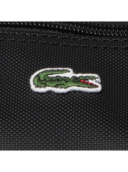 Schwarze Lacoste Damentasche Shopping Bag, L-Format, weiches Material, mit Logo-Print und Tragegriffen.