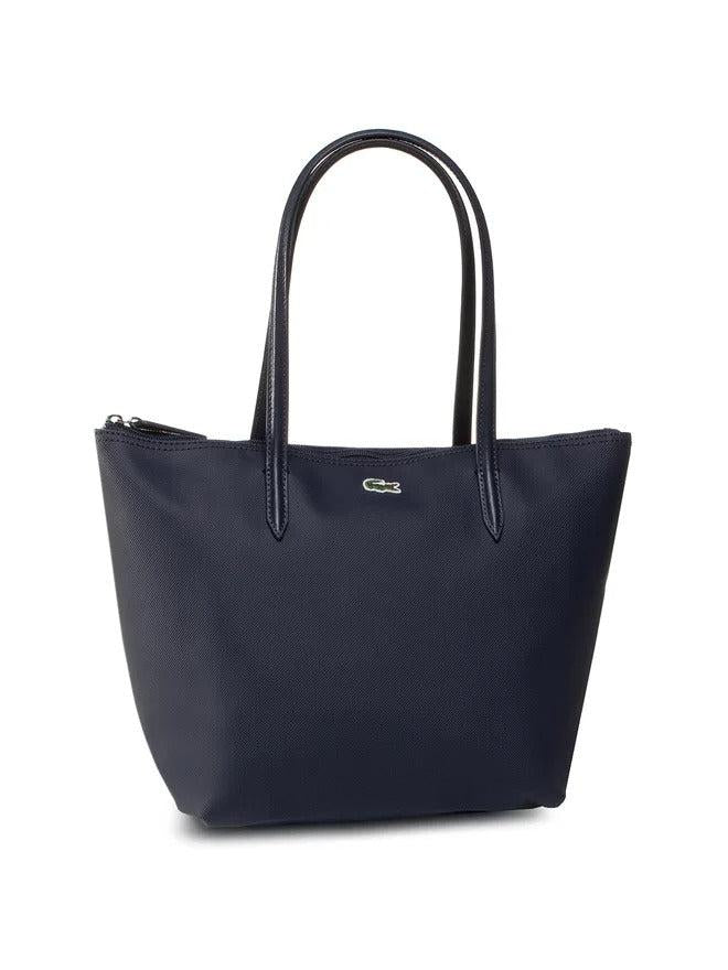 Damentasche von Lacoste, dunkelblaue Shopping Bag, aus robustem Material mit Marken-Logo, leicht und stilvoll für den Alltag.